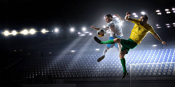 Soccer palyers fighting for ball . Mixed media stock photo
