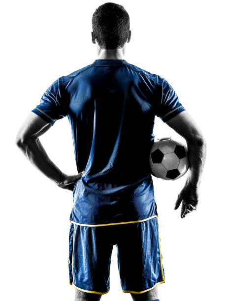 voetbal speler mens staande terug silhouet geïsoleerd - basketball player back stockfoto's en -beelden