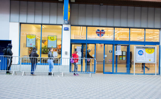 Social distancing. Turnpike Lane. Social distancing in front of Lidl Wood Green, London, during the Coronavirus pandemic. 26 March 2020. lidl stock pictures, royalty-free photos & images
