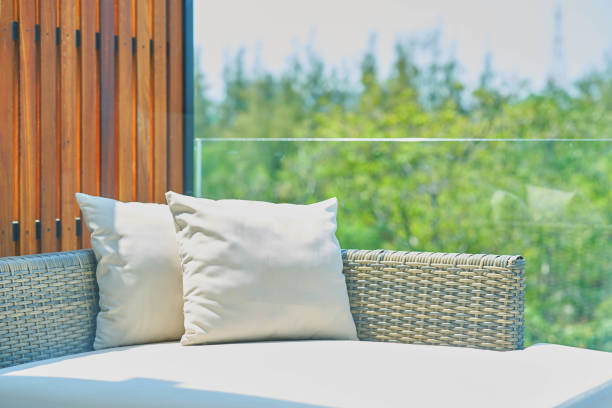 sofa with pillows in sunlight ,outdoors stock photo
