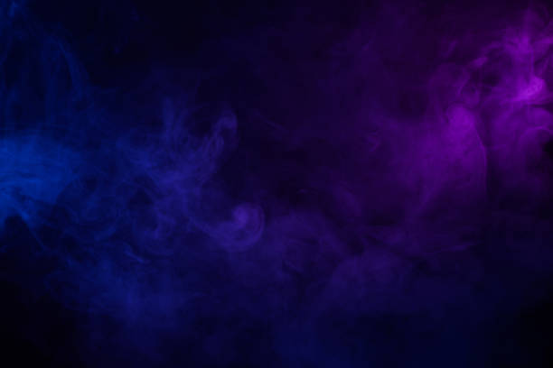 Soft clouds of colorful smoke on dark background Soft clouds of colorful smoke dark abstract background purple stock pictures, royalty-free photos & images