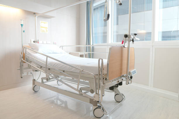 Soft focus background of electrical adjustable patient bed in hospital room stock photo