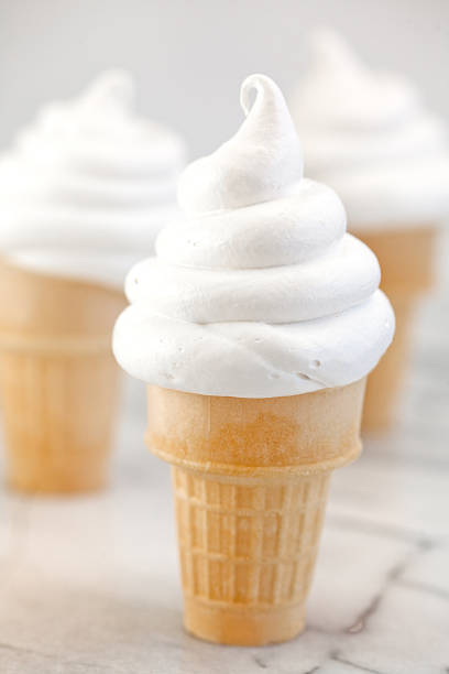 Soft serve vanilla ice cream cones stock photo