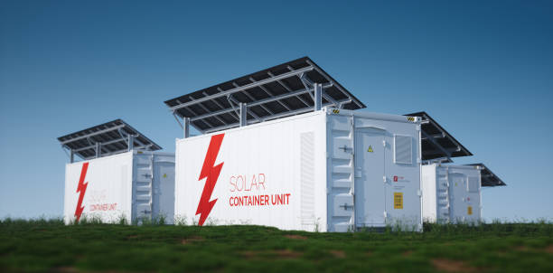 Solar container unit. 3d rendering concept of a white industrial battery energy storage container with mounted black solar panels situated on fresh green grass in late sunny weather.  storage unit stock pictures, royalty-free photos & images