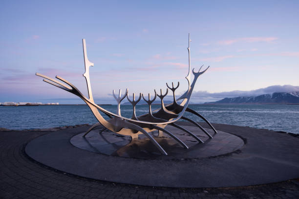 solar of sun voyager with the mountain in background the monument at reykjavik bay have the fog on the mountain at background reykjavik stock pictures, royalty-free photos & images