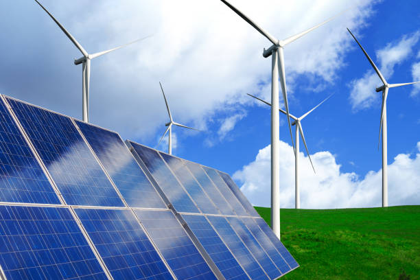 solar panel and wind turbine farm clean energy. - energias renováveis imagens e fotografias de stock