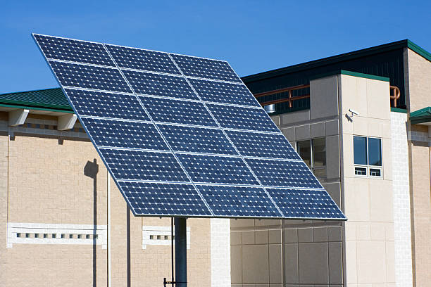 Solar panel in front of hospital  climate action stock pictures, royalty-free photos & images