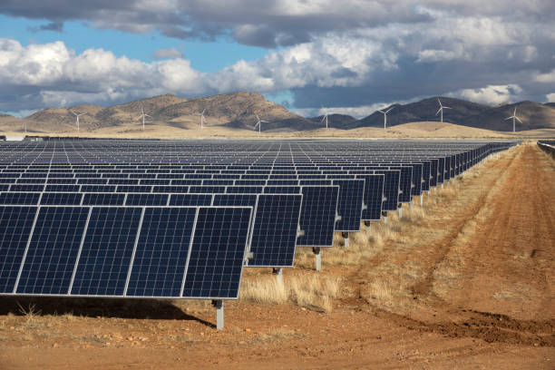 Solar panels wind farm turbines Wilcox Arizona Sonoran Desert Mountains stock photo