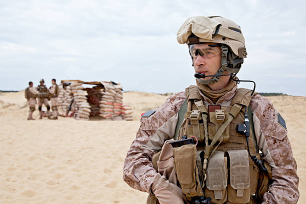Soldier standing in the desert stock photo