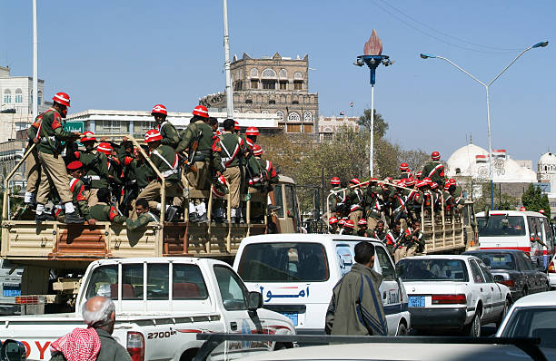 Soldiers sitting on military trucks on the streets of Sana stock photo