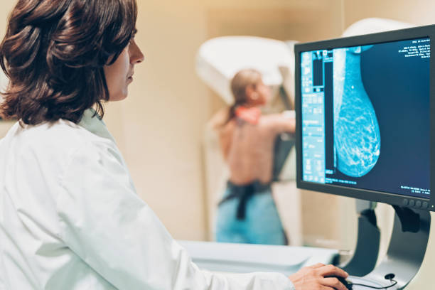 Solving women's health issues Doctor and patient making a mammography x ray stock pictures, royalty-free photos & images