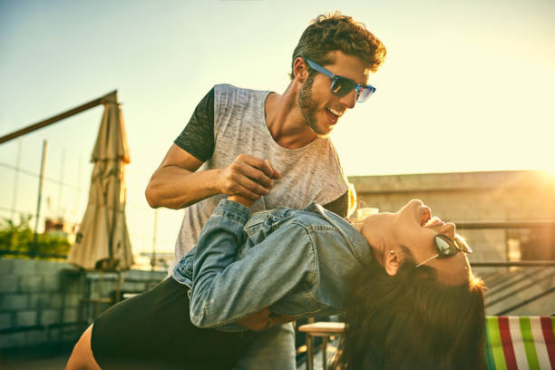 Some of the most romantic moments are spontaneous Shot of an affectionate young couple dancing together outdoors boyfriend photos stock pictures, royalty-free photos & images