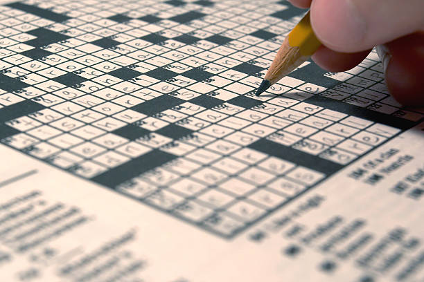 Someone doing the daily crossword stock photo
