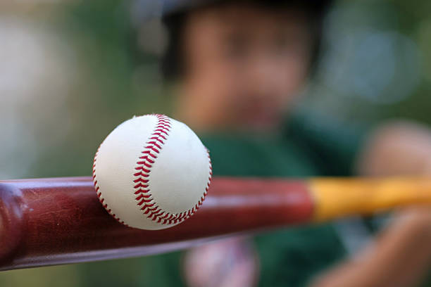 Someone hits the baseball maroon stock photo