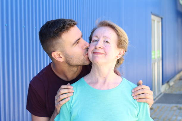 Son kissing his mother portrait Son kissing his mother portrait. cougar woman stock pictures, royalty-free photos & images