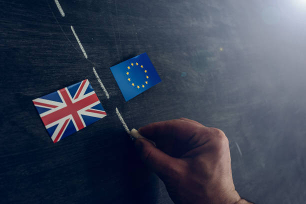 Soon there will be a border between European Union and England Hand drawing with chalk on blackboard a line to separate the Great Britain flag from the EU. Brexit concept brexit stock pictures, royalty-free photos & images