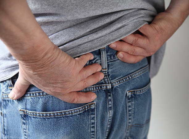 soreness in the hip area stock photo