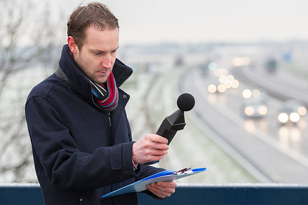 Sound pollution, man near highway Noise pollution, man made noise measurements near highway meter instrument of measurement stock pictures, royalty-free photos & images