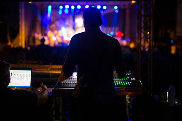 Sound technician at music festival DJ at music festival producer stock pictures, royalty-free photos & images