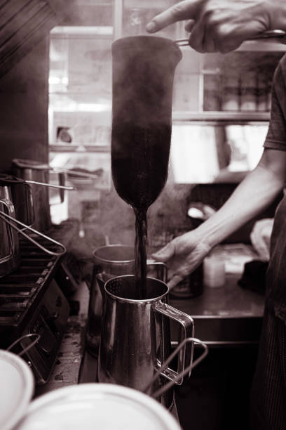 South East Asia: Making Milk Tea at Lan Fong Yuen in Hong Kong stock photo