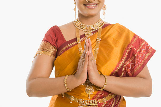 South Indian woman greeting with folded hands South Indian woman greeting with folded hands namaste greeting stock pictures, royalty-free photos & images