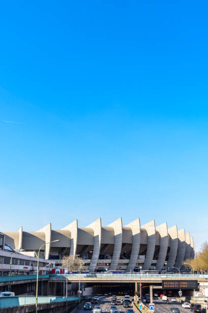 Southeast side of the Parc des Princes stadium in Paris, France, built partially above the ring road. Paris, France - March 21, 2019: Southeast side of the all-seater Parc des Princes stadium, home stadium of Paris Saint-Germain (PSG) football club, built in 1972 partially above Paris ring road. paris saint germain stock pictures, royalty-free photos & images