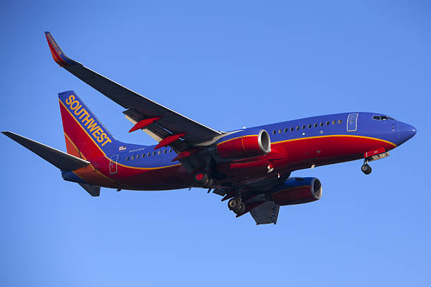 Southwest Airlines 737 Commercial Jet Airplane Los Angeles, CA, USA - May 24, 2015. Southwest Airlines Boeing 737-7H4 lands at Los Angeles Airport (LAX) on May 24, 2015. The plane has a range of 6,340 miles with 177 seats. southwest stock pictures, royalty-free photos & images