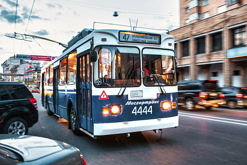 Moscow, Russia - September 10 2010 : a soviet era classic public trolley bus on the busy streets of downtown Moscow