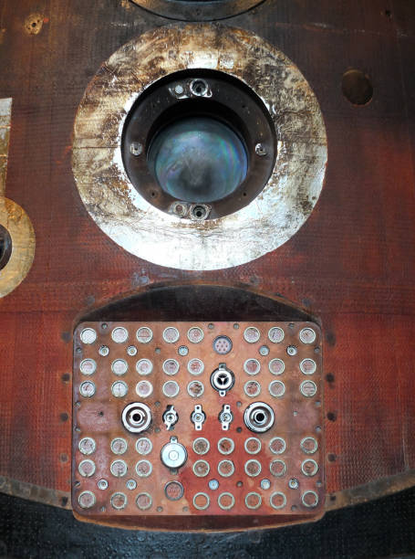 soyuz capsule window and connecting panel with reentry burns and scorch marks close up soyuz capsule window and connecting panel with reentry burns and scorch marks reentry stock pictures, royalty-free photos & images