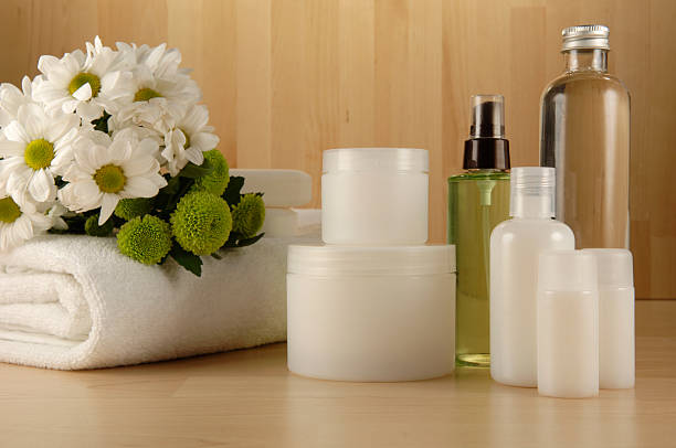 spa cosmetics series cosmetics bottles on wooden surface cosmetic packaging stock pictures, royalty-free photos & images