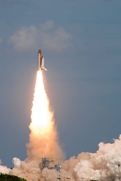 A space shuttle being launched into the sky Launch of Space Shuttle Atlantis for the STS-122 mission rocket fire stock pictures, royalty-free photos & images