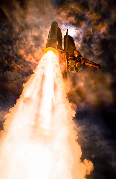 Spaceship launch at night, low-angle perspective. The elements of this image furnished by NASA. Spaceship launch at night, low-angle perspective. The elements of this image furnished by NASA. spaceport stock pictures, royalty-free photos & images