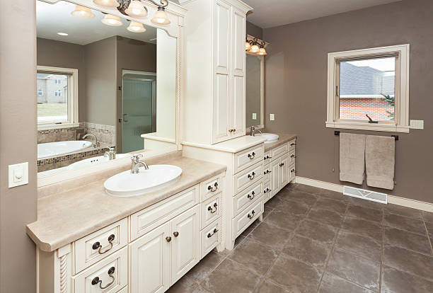 Spacious Bathroom With Custom Cabinetry and Tile Floor stock photo