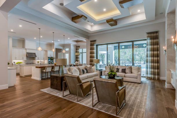 Spacious great room in newly built Florida home Open floor plan with high ornate coffered ceilings open plan photos stock pictures, royalty-free photos & images