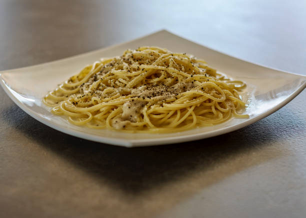 Spaghetti Pasta Cacio e Pepe (Cheese and Pepper). stock photo