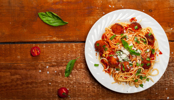 Spaghetti pasta with meatballs and tomato sauce, top view stock photo