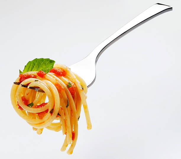 Spaghetti tomato sauce and basil stock photo