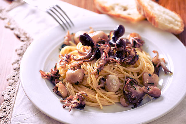 Spaghetti with squid, cuttlefish, octopus stock photo