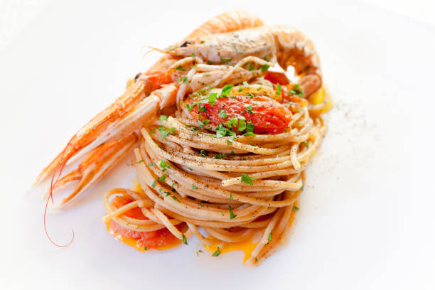 Spaghetti with tomato and Nephrops stock photo