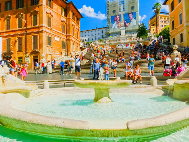 Rome, Italy - September 10, 2015: Spanish steps and Ugly Boat fountain surronded by hundreds of tourists Rome, Italy - September 10, 2015: Spanish steps and Ugly Boat fountain surronded by hundreds of tourists with Trinita dei Monti church on background at Rome, Italy on September 10, 2015 serie a stock pictures, royalty-free photos & images