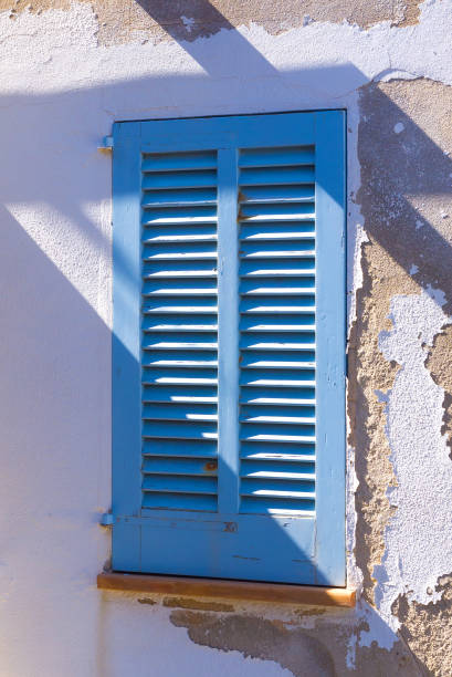 Spanish window shutter stock photo