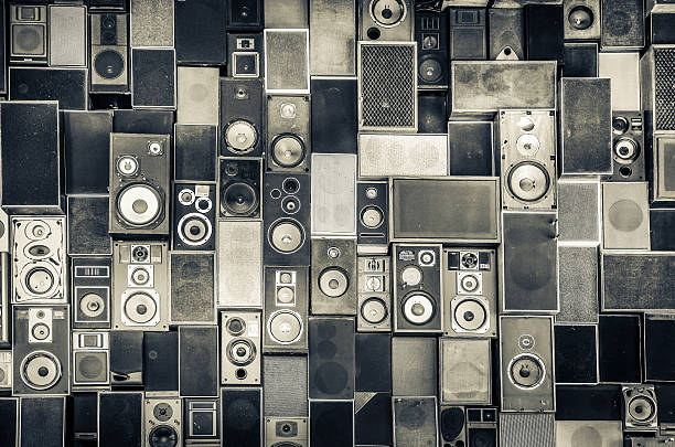 Speakers hanging on wall in monochrome style stock photo