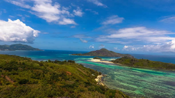 Spectacular aerial view of Cerf Island and the hilly uninhabited islands in the Indian Ocean. stock photo
