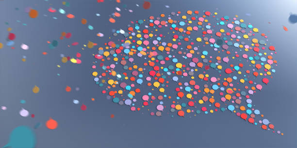 A Speech Bubble Icon Shape Made from Lots of Smaller Multi-Coloured Speech Bubbles Falling From Above stock photo