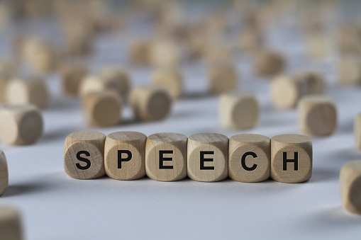 speech - cube with letters, sign with wooden cubes