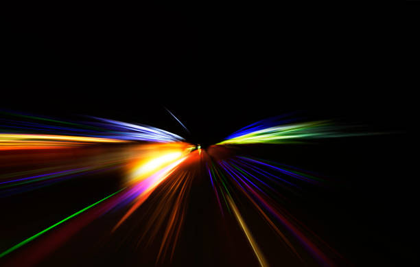 Speed motion blur colorful light Car moving on highway against dark night, photograph is taken with long exposure. light trail photos stock pictures, royalty-free photos & images