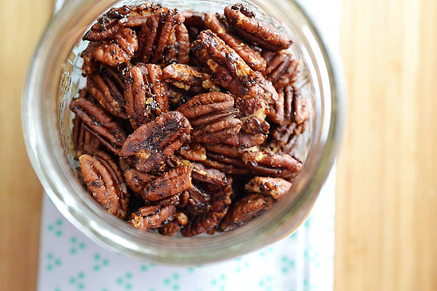 spiced pecan nuts sweet & spicy  pecan stock pictures, royalty-free photos & images