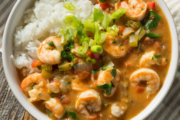 Spicy Homemade Cajun Shrimp Etouffee Spicy Homemade Cajun Shrimp Etouffee with White Rice gumbo stock pictures, royalty-free photos & images