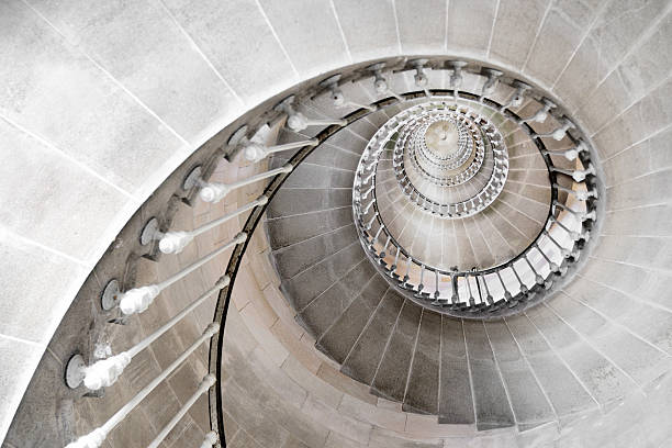 spiral staircase - old stone stair stockfoto's en -beelden