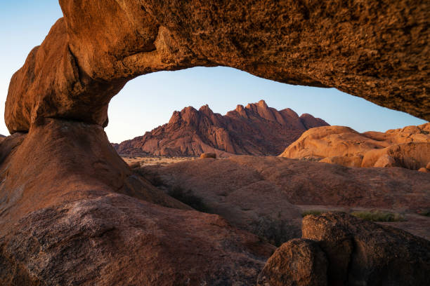 Spitzkoppe Rock Arch at Sunset in Damaraland, Namib Desert, Namibia stock photo